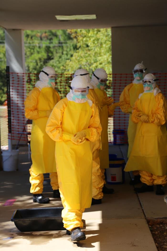Healthcare workers in full personal protective equipment used when treating Ebola patients, as UN officials warn the DR Congo outbreak remains massive